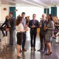 people gather to socialize at reception