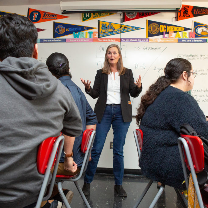 A teacher kicks off a lesson during an AP research class.