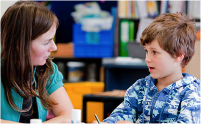 Teacher with young student