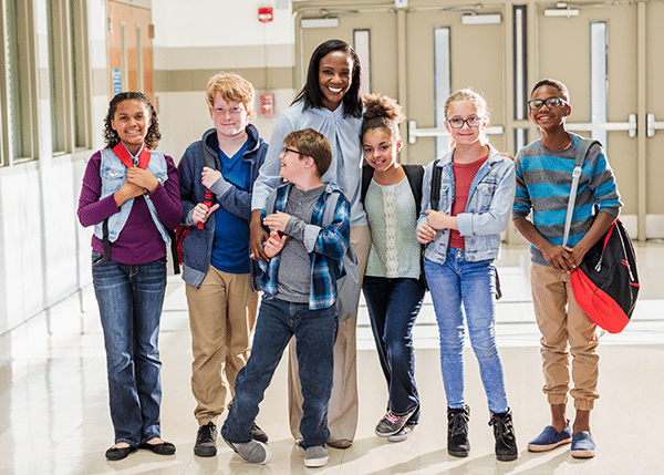 Principal with Kids in Hallway