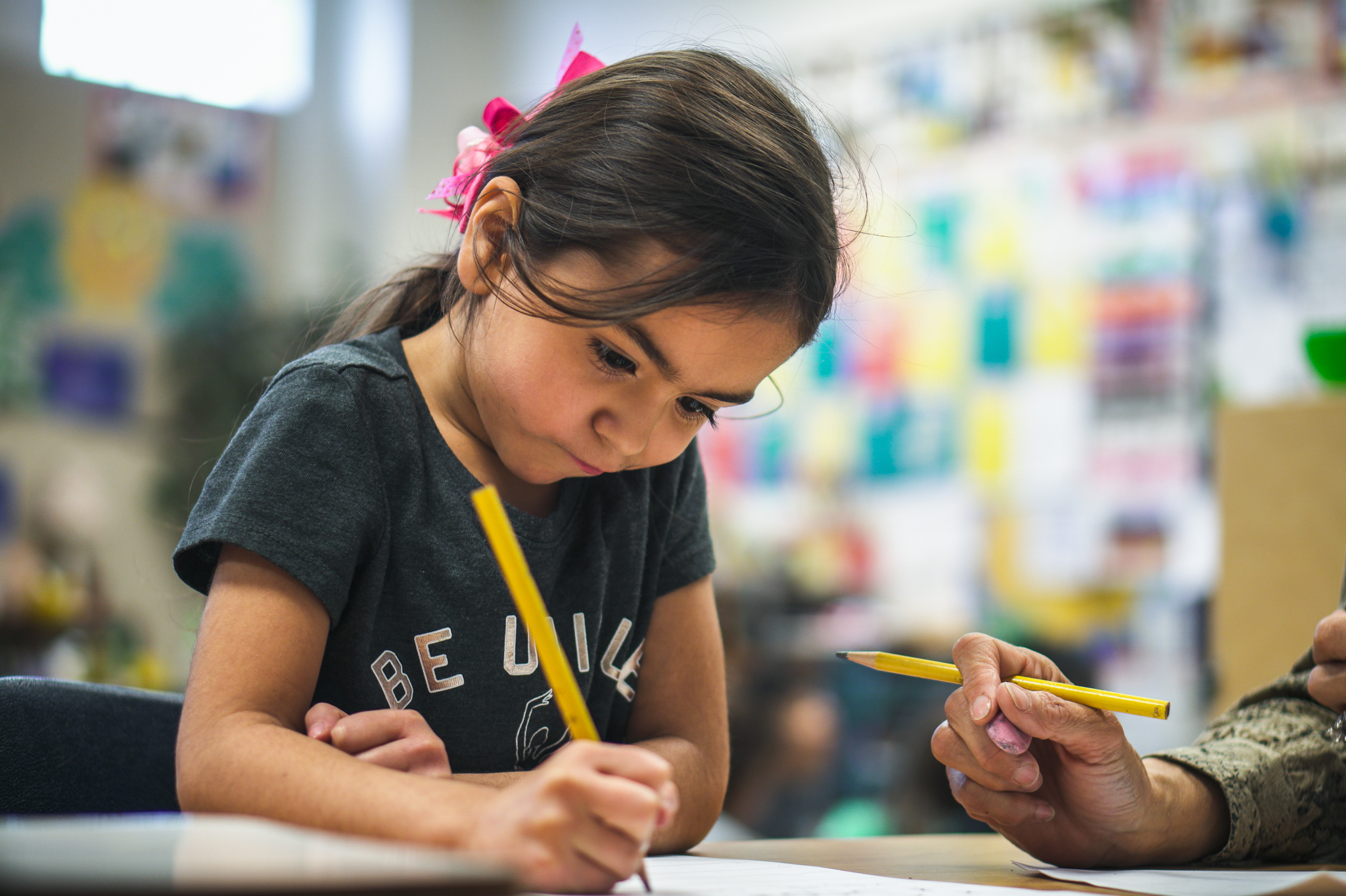A young student in Paradise Valley, Arizona, works with her teacher.